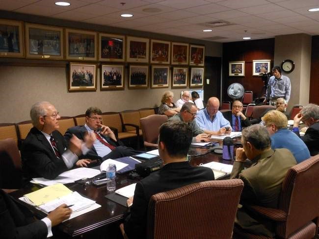 Photo by Wm. Shawn Weigel. New Castle County Councilmember Bob Weiner, far left, talks about his efforts to video capture council sessions on Tuesday, March 25, during an executive committee meeting. At far right, Brian Windle of OK Video records the session courtesy of funds from the Friends of Bob Weiner PAC.